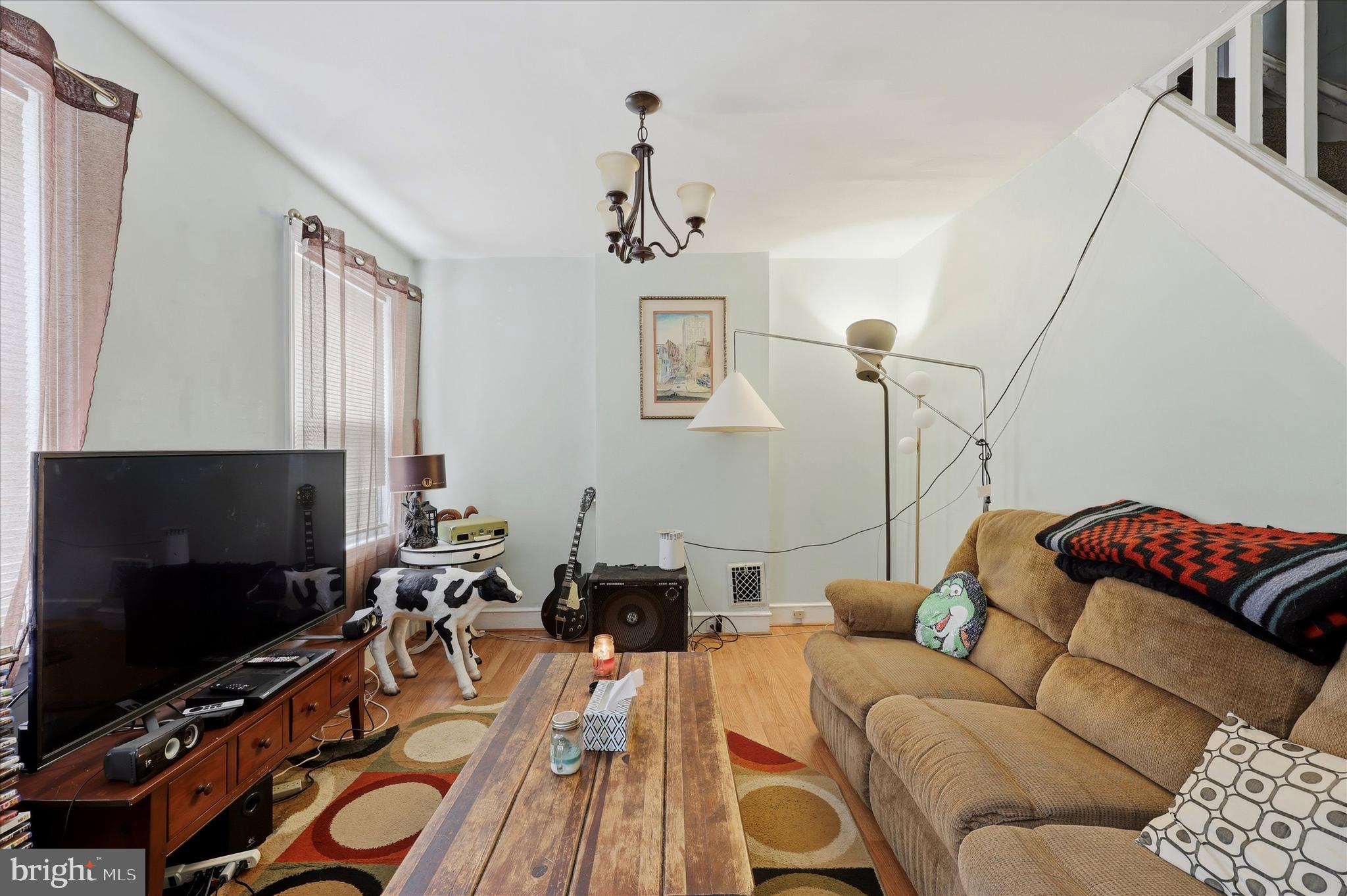 2442 East Gordon Street Philadelphia, PA 19125 - Photo 2 of 40 a living room with furniture and a flat screen tv