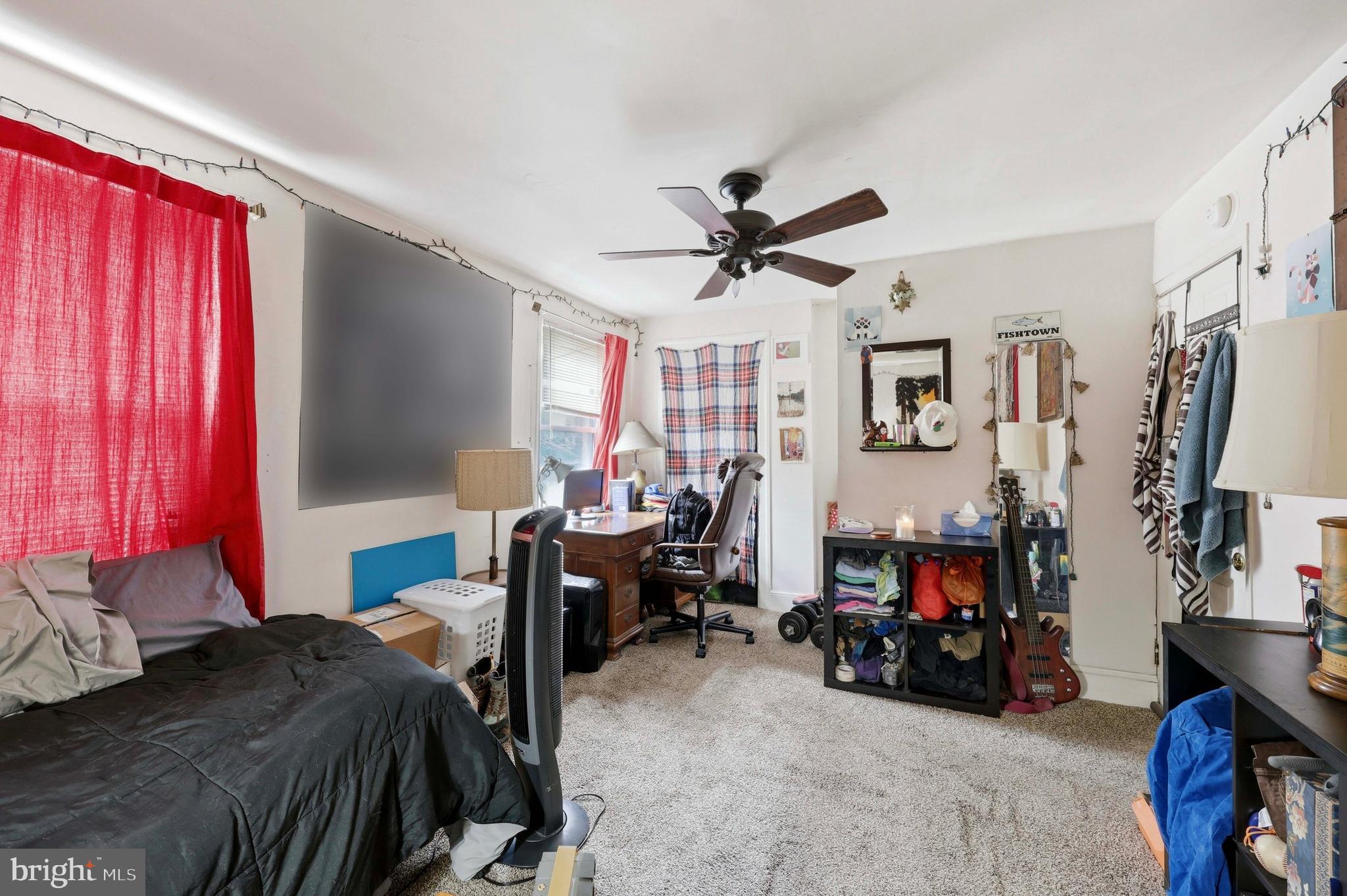 2442 East Gordon Street Philadelphia, PA 19125 - Photo 26 of 40 a bed room with a bed closet and a window