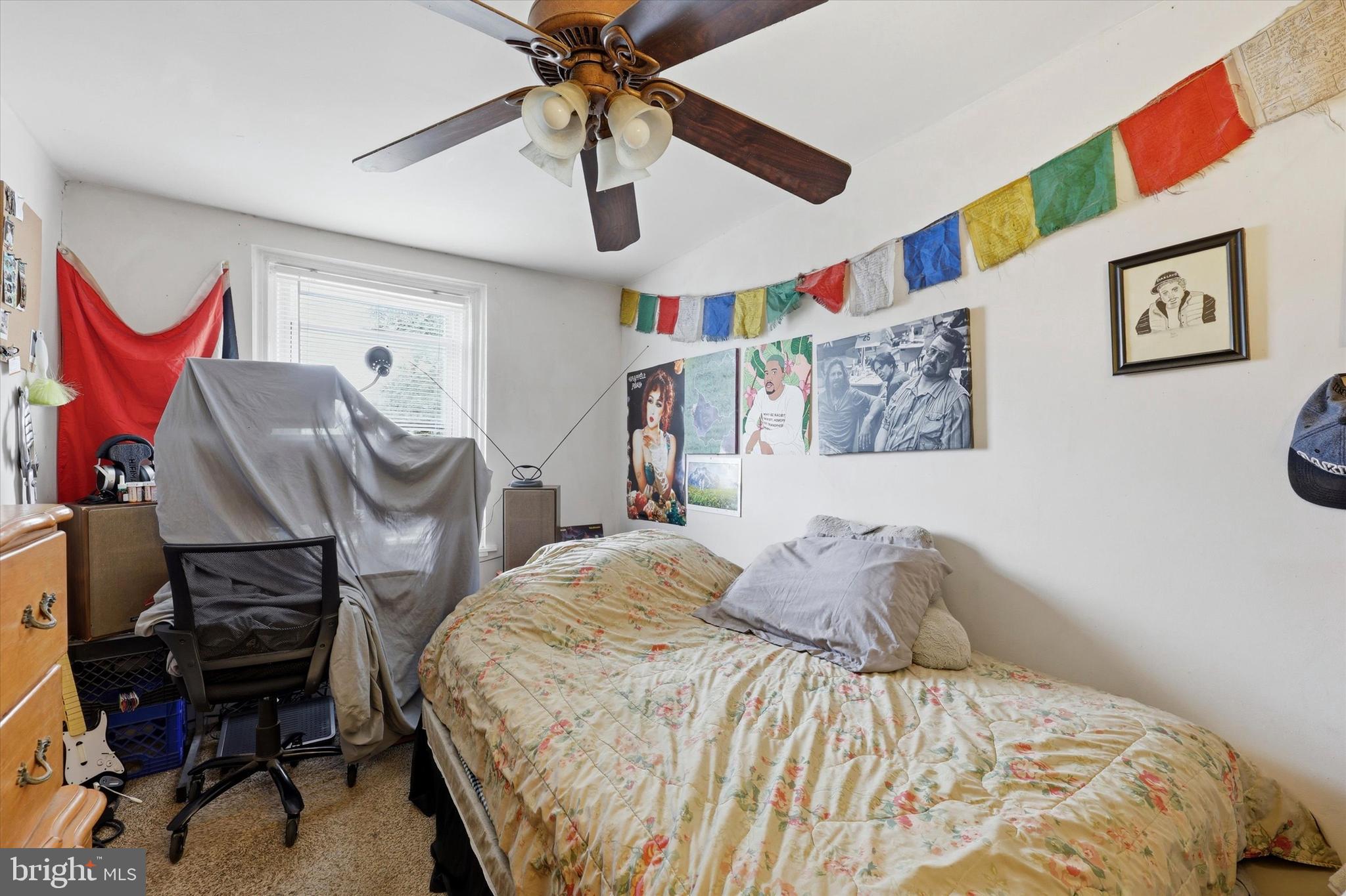 2442 East Gordon Street Philadelphia, PA 19125 - Photo 29 of 40 a bedroom with a bed and a chandelier