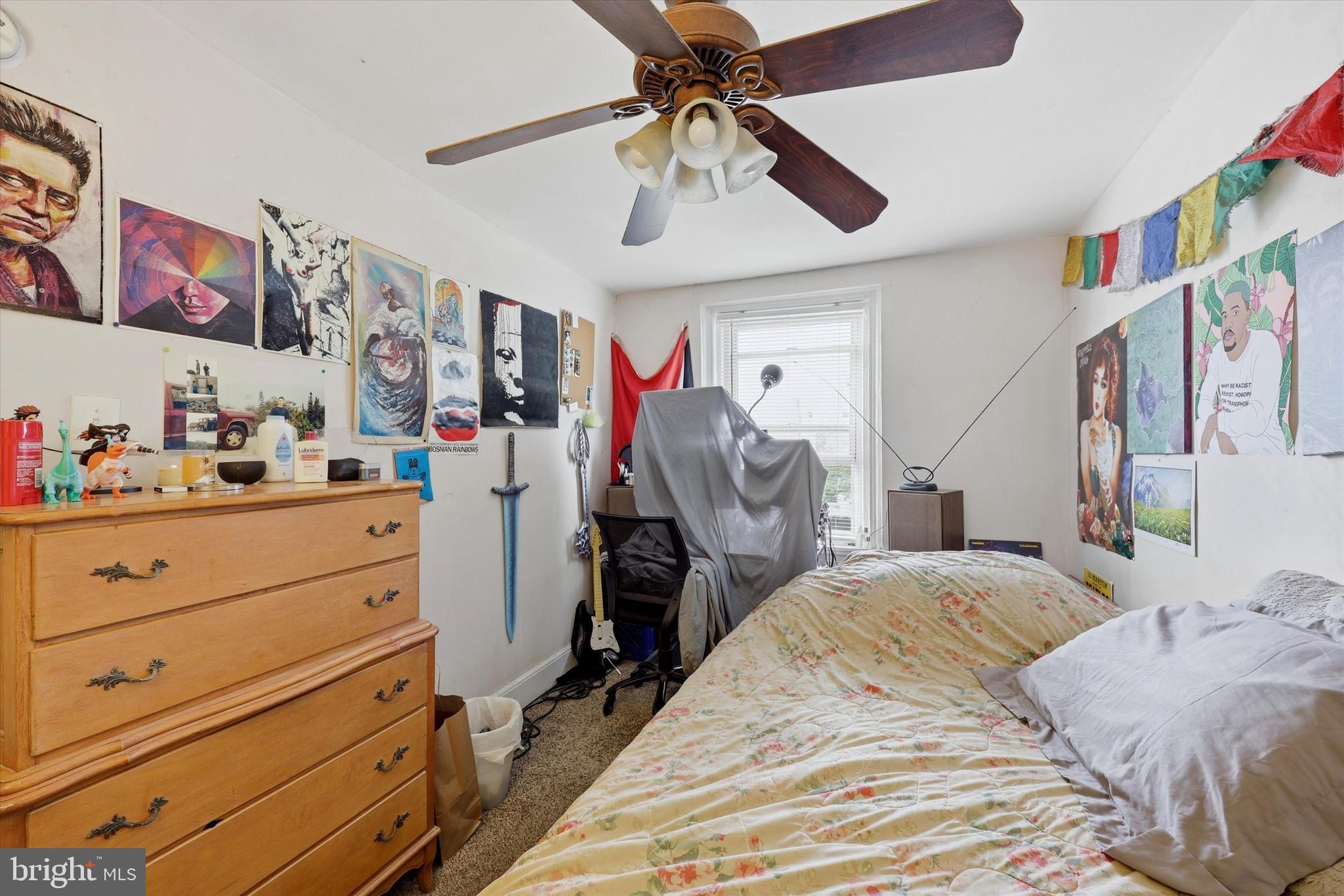2442 East Gordon Street Philadelphia, PA 19125 - Photo 30 of 40 a bedroom with a bed and a chandelier