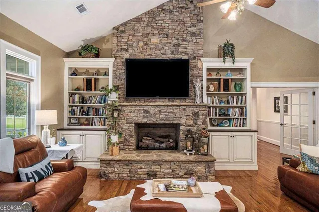 a kitchen with stainless steel appliances granite countertop a stove and a refrigerator