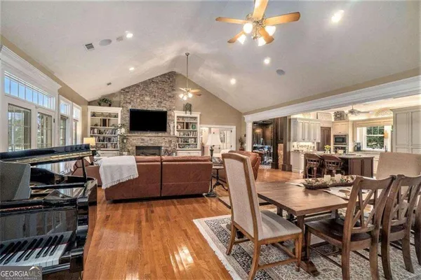 a bedroom with a large bed and a flat screen tv