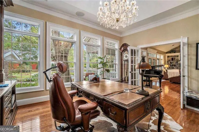 a view of a house with swimming pool and sitting area