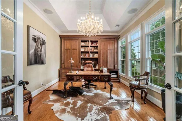 a front view of a house with swimming pool having outdoor seating
