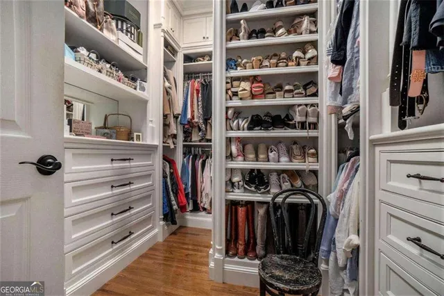 a backyard of a house with lots of green space and trees