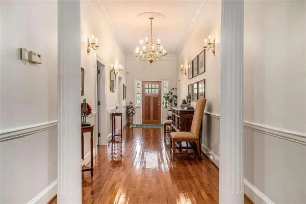 a bathroom with a granite countertop sink a mirror and shower
