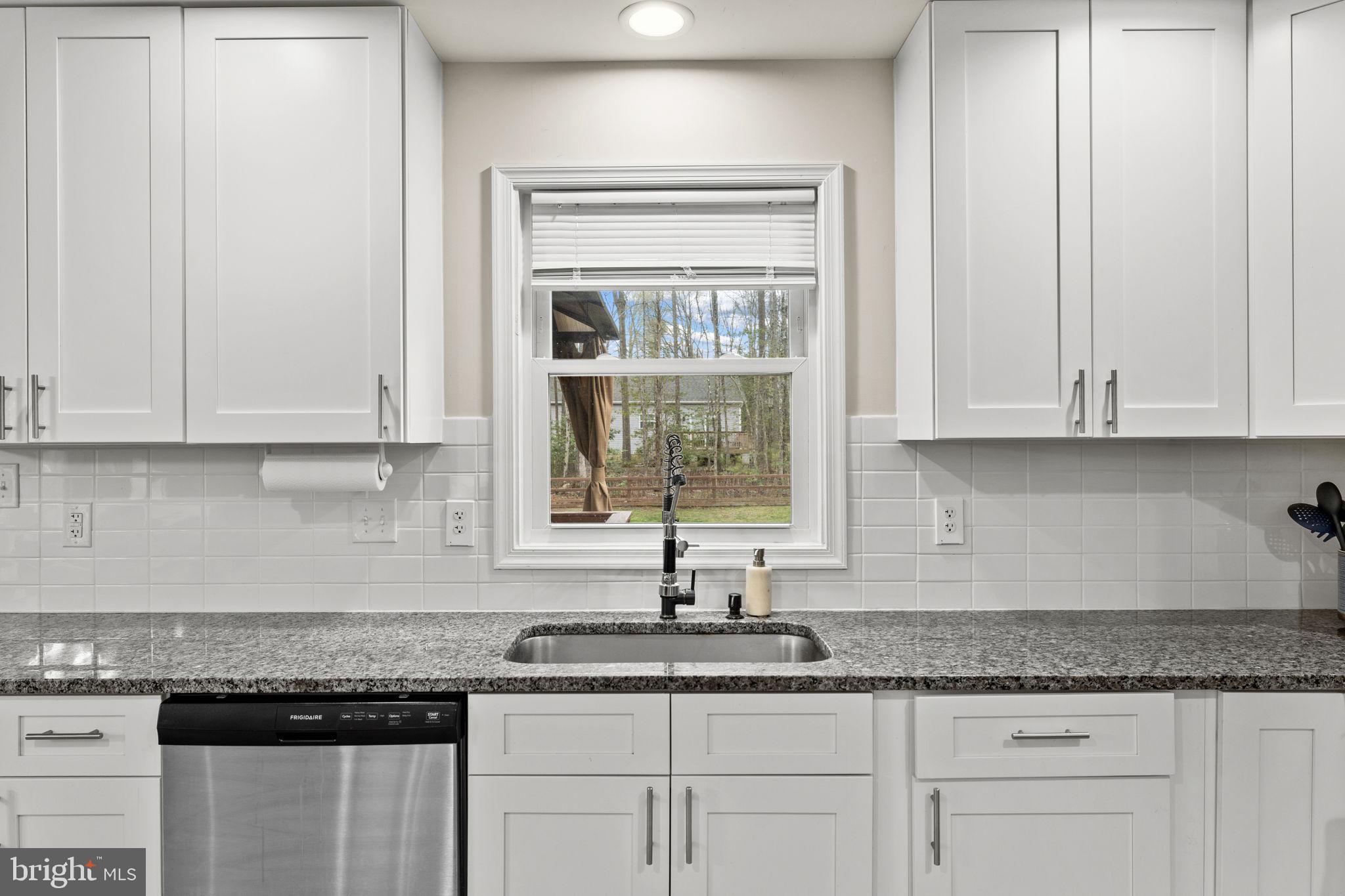 84 Pinewood Lane Colonial Beach, VA 22443 - Photo 14 of 38 Bright kitchen with serene views.