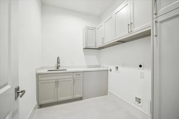 a kitchen with a sink and cabinets
