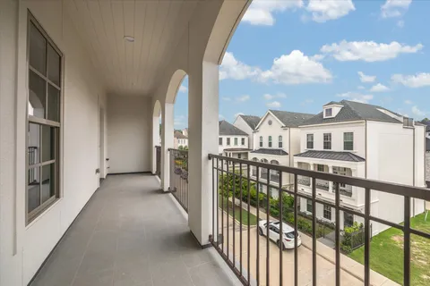 a view of a balcony with wooden floor