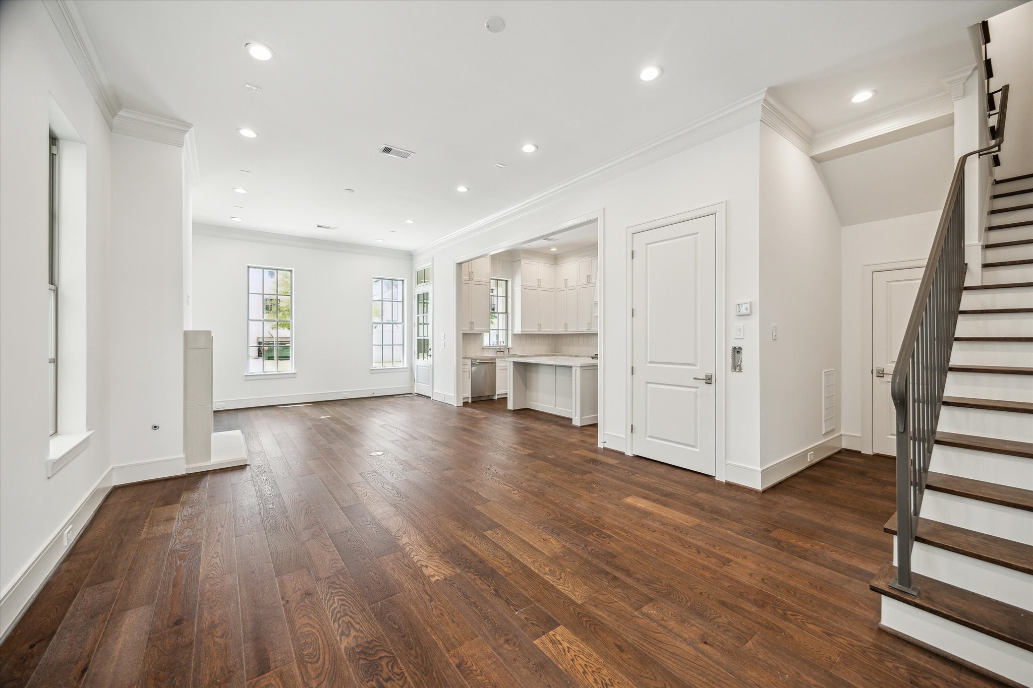 209 Sutton Row Place Houston, TX 77024 - Photo 5 of 23 a view of empty room with wooden floor and window