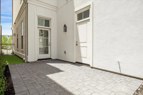 a view of a house with backyard and white door