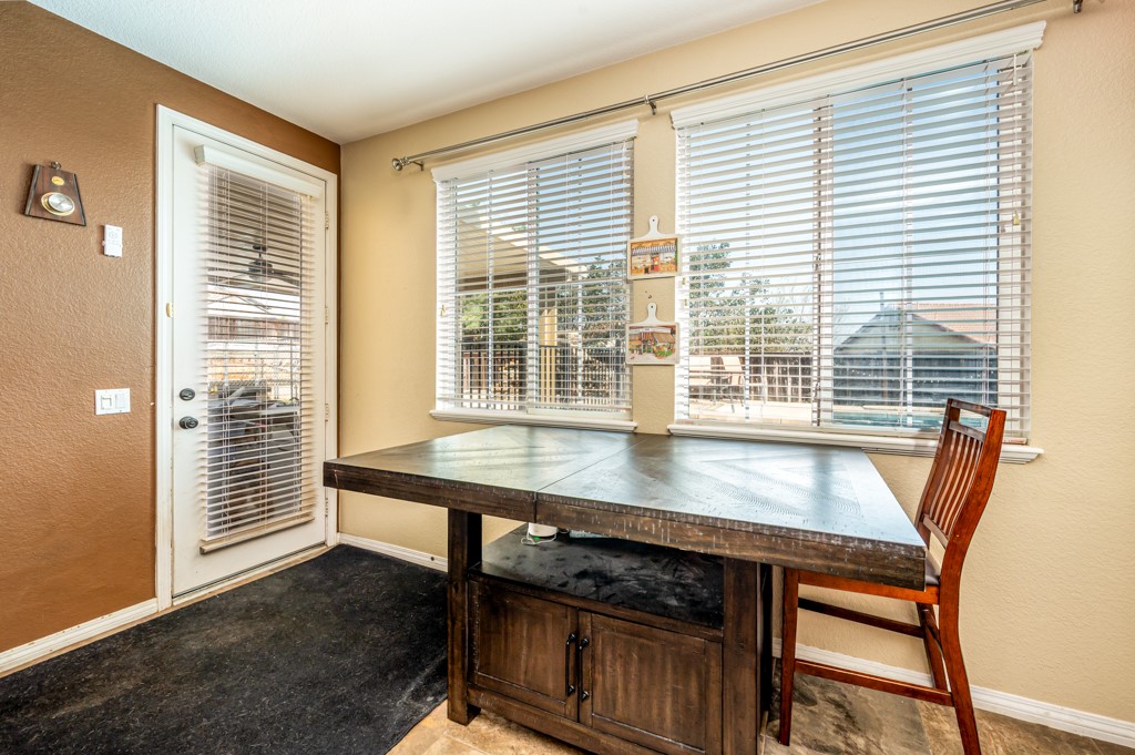 18668 Alderbrook Drive Riverside, CA 92508 - Photo 15 of 28 a view of a dining room with furniture and windows