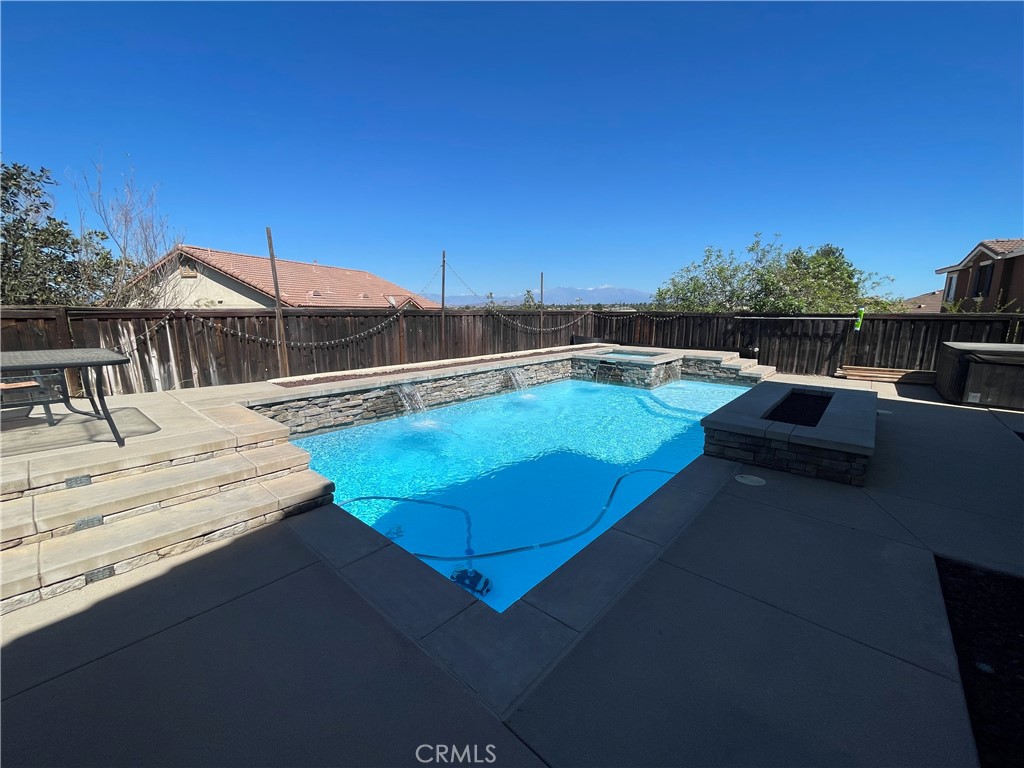 18668 Alderbrook Drive Riverside, CA 92508 - Photo 18 of 28 a view of a swimming pool with lounge chairs