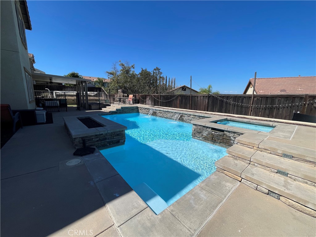 18668 Alderbrook Drive Riverside, CA 92508 - Photo 19 of 28 a view of swimming pool with outdoor seating and a terrace view