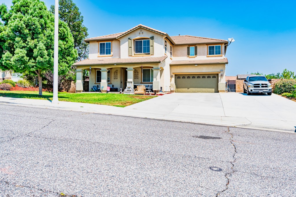 18668 Alderbrook Drive Riverside, CA 92508 - Photo 24 of 28 a front view of a house with a yard and trees