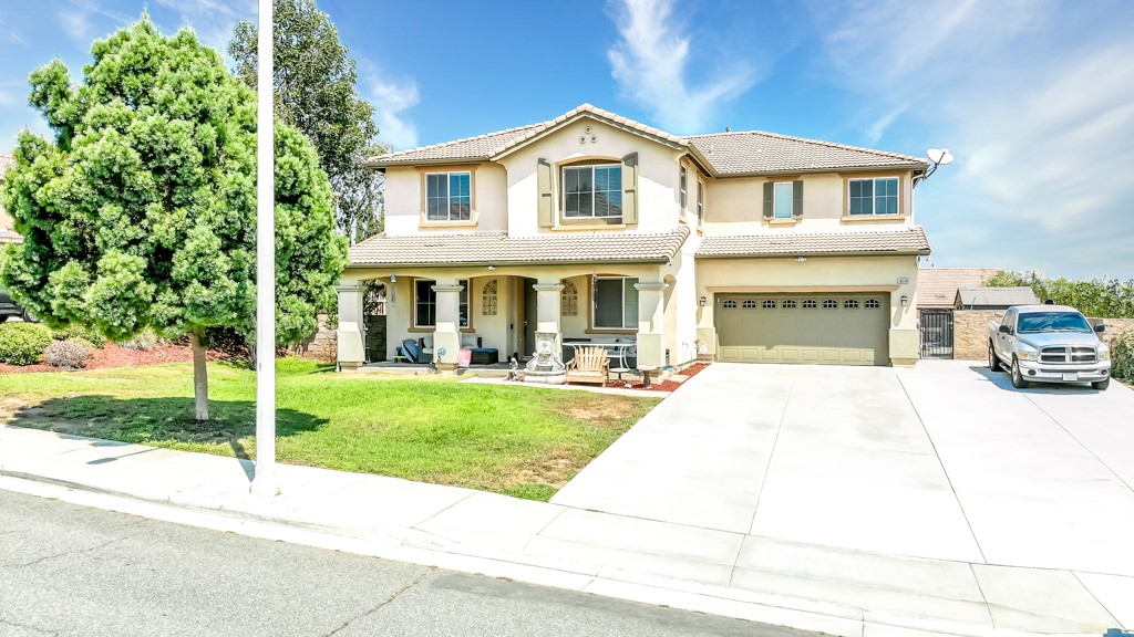 18668 Alderbrook Drive Riverside, CA 92508 - Photo 25 of 28 a front view of a house with a yard and garage