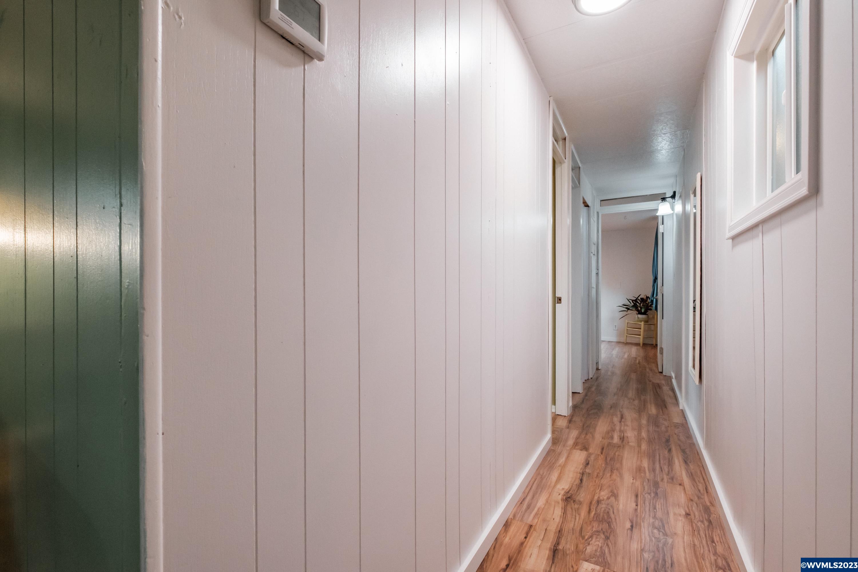 4915 Swegle Road Northeast, Unit 47 Salem, OR 97301 - Photo 23 of 36 a view of hallway with wooden floor
