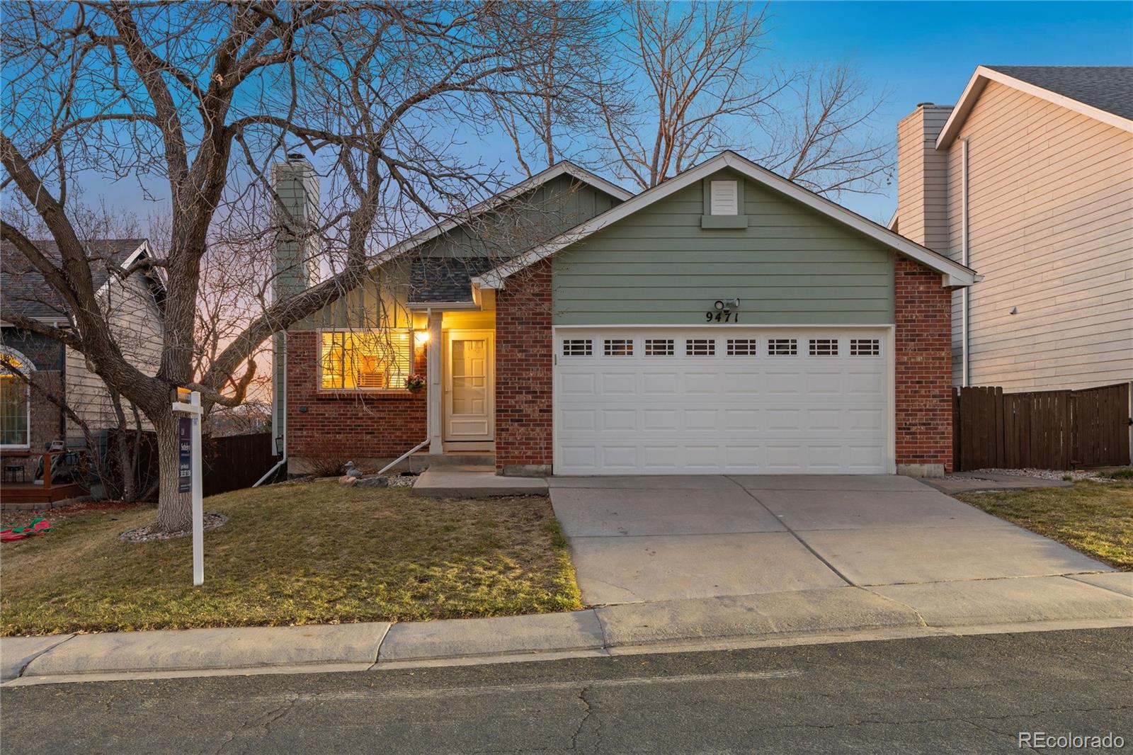 9471 Burlington Lane Highlands Ranch, CO 80130 - Photo 1 of 50 a view of a house with a yard