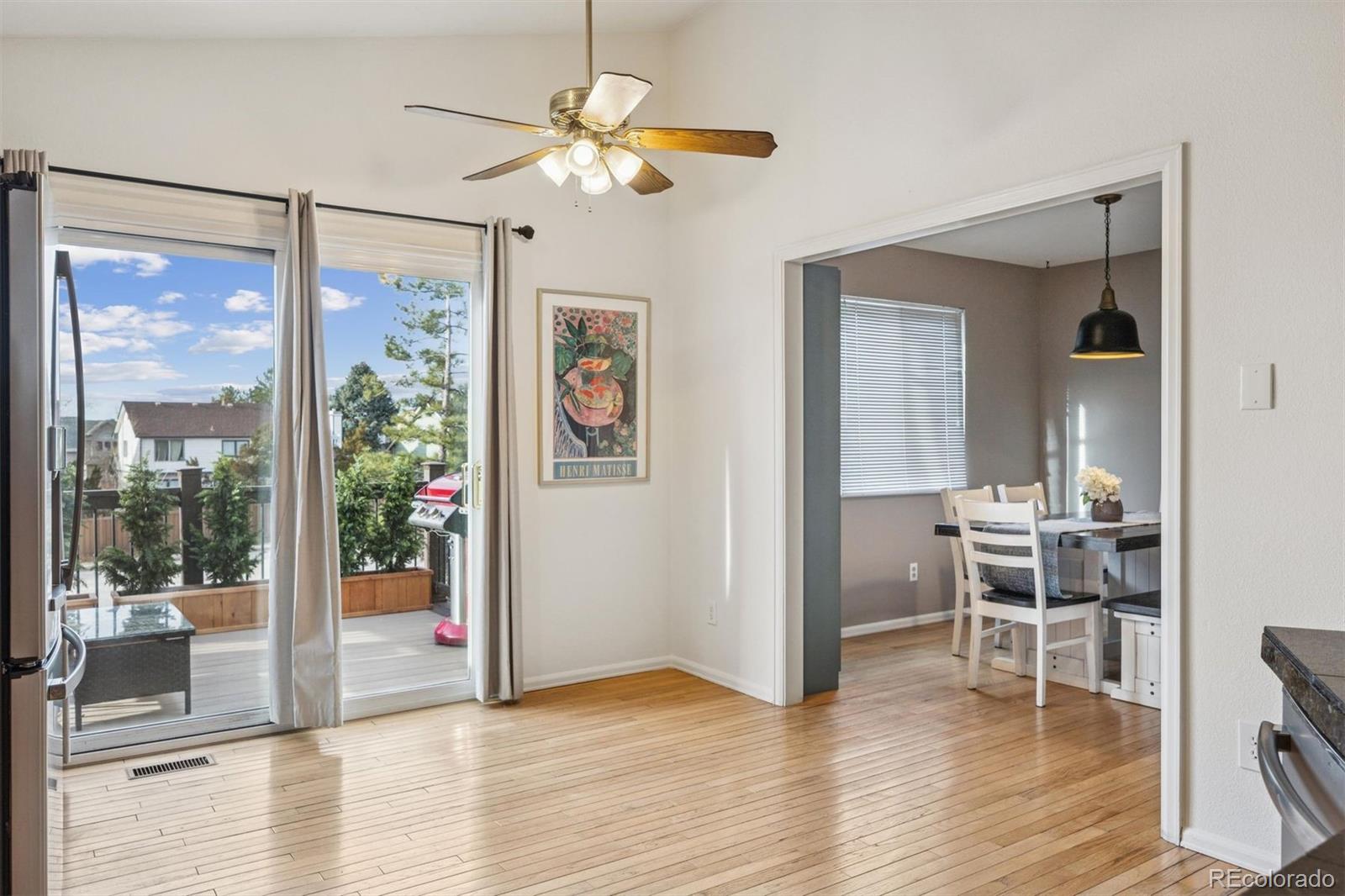 9471 Burlington Lane Highlands Ranch, CO 80130 - Photo 16 of 50 a view of a livingroom with furniture window and wooden floor