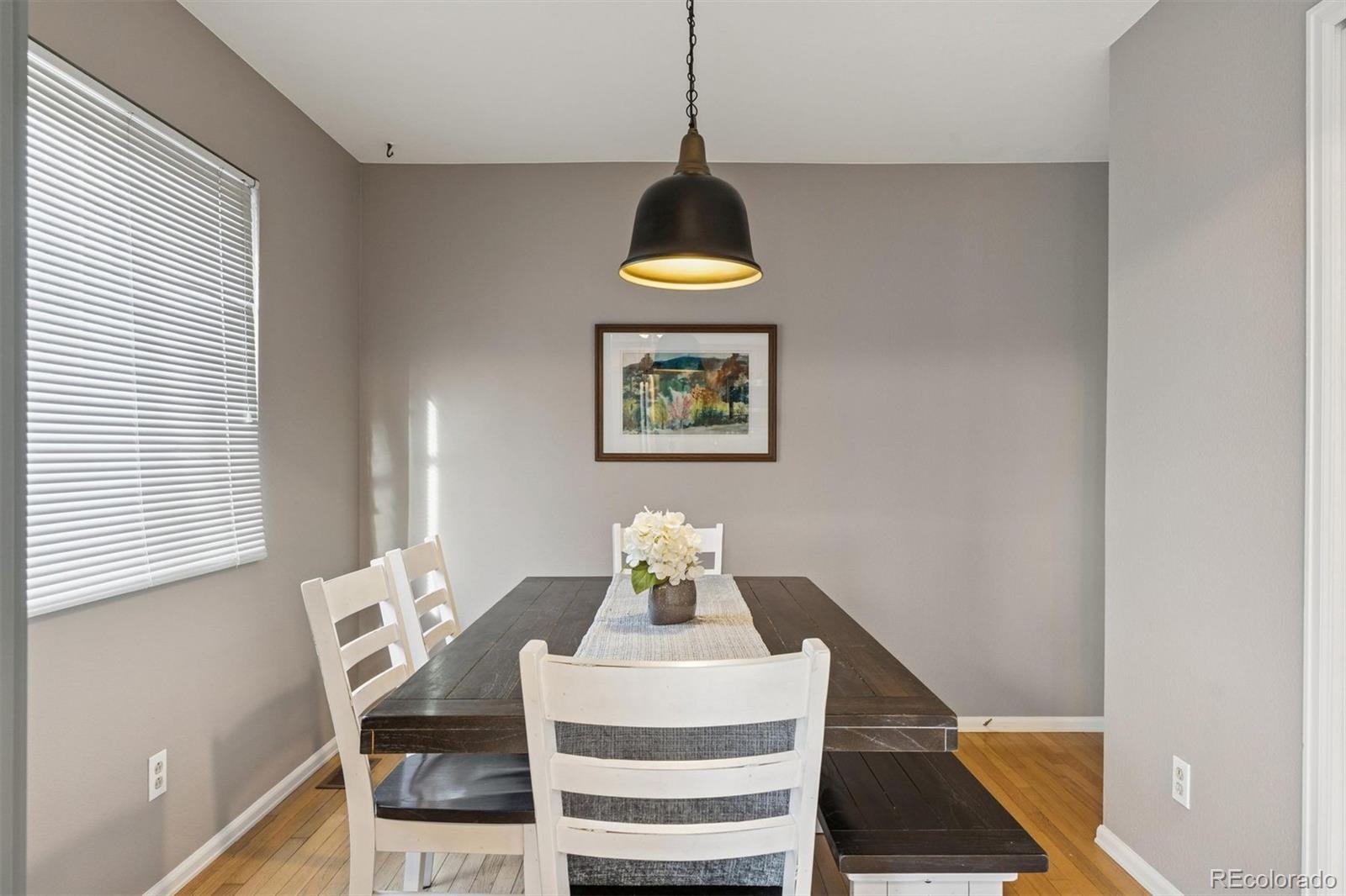 9471 Burlington Lane Highlands Ranch, CO 80130 - Photo 20 of 50 a dining room with window and cabinet