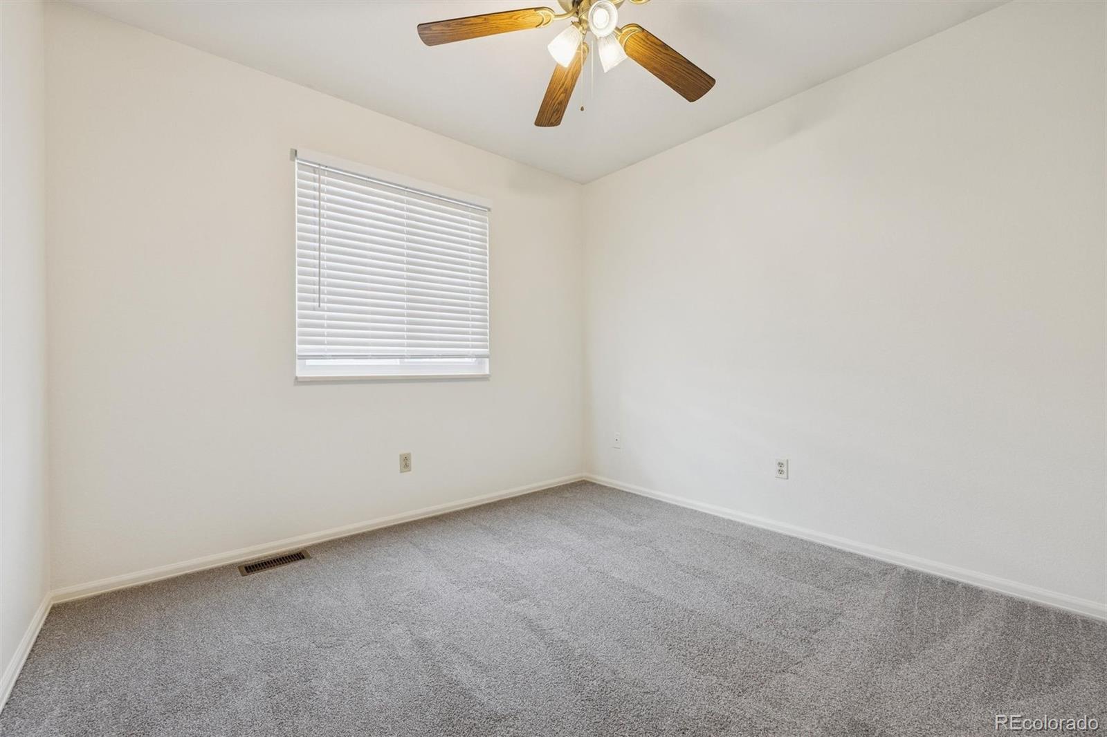 9471 Burlington Lane Highlands Ranch, CO 80130 - Photo 26 of 50 an empty room with a window