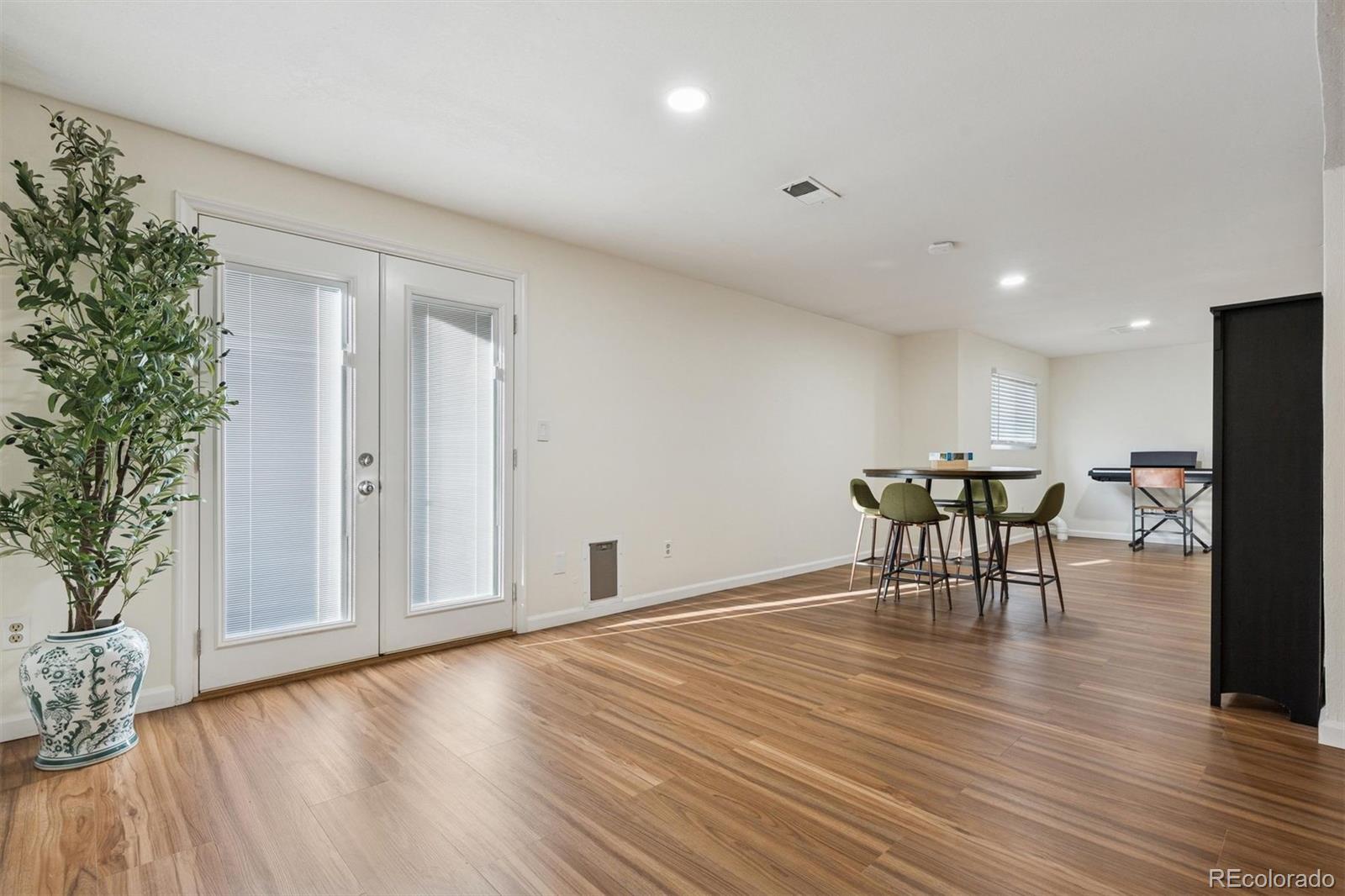 9471 Burlington Lane Highlands Ranch, CO 80130 - Photo 28 of 50 a view of a room with furniture and wooden floor