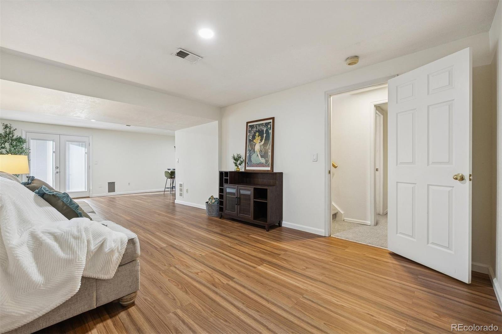 9471 Burlington Lane Highlands Ranch, CO 80130 - Photo 29 of 50 a spacious bedroom with a bed and a dresser