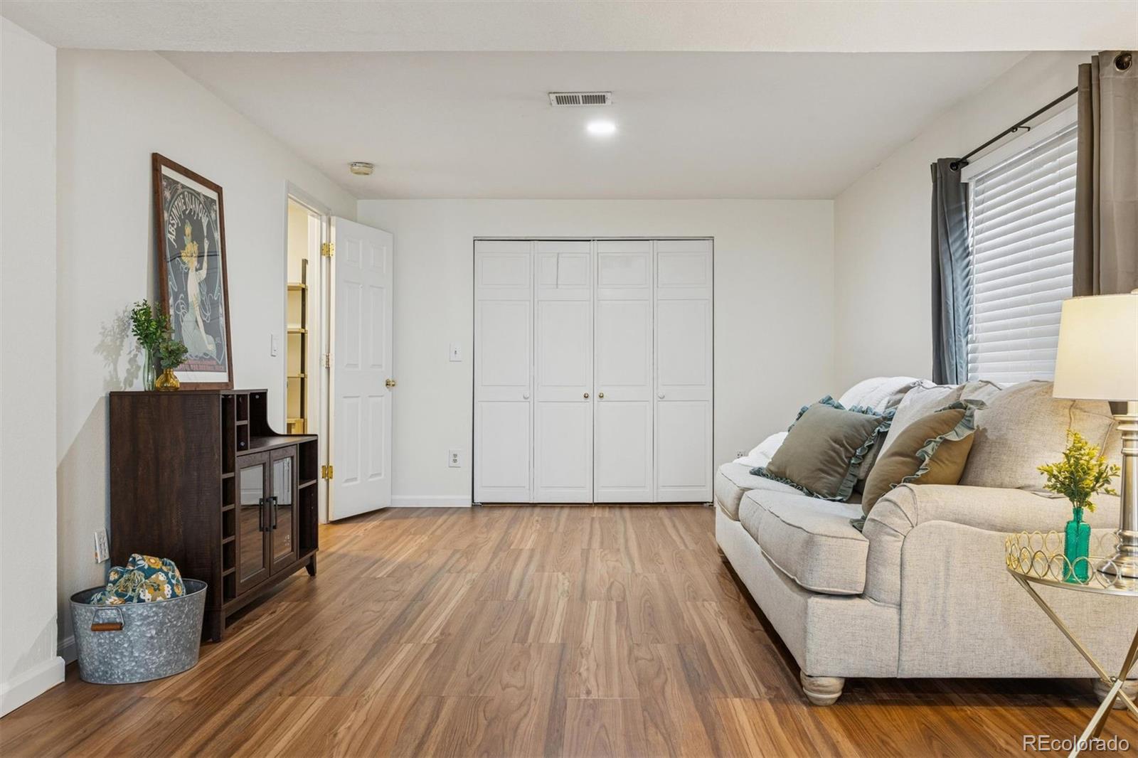 9471 Burlington Lane Highlands Ranch, CO 80130 - Photo 35 of 50 a living room with furniture and wooden floor