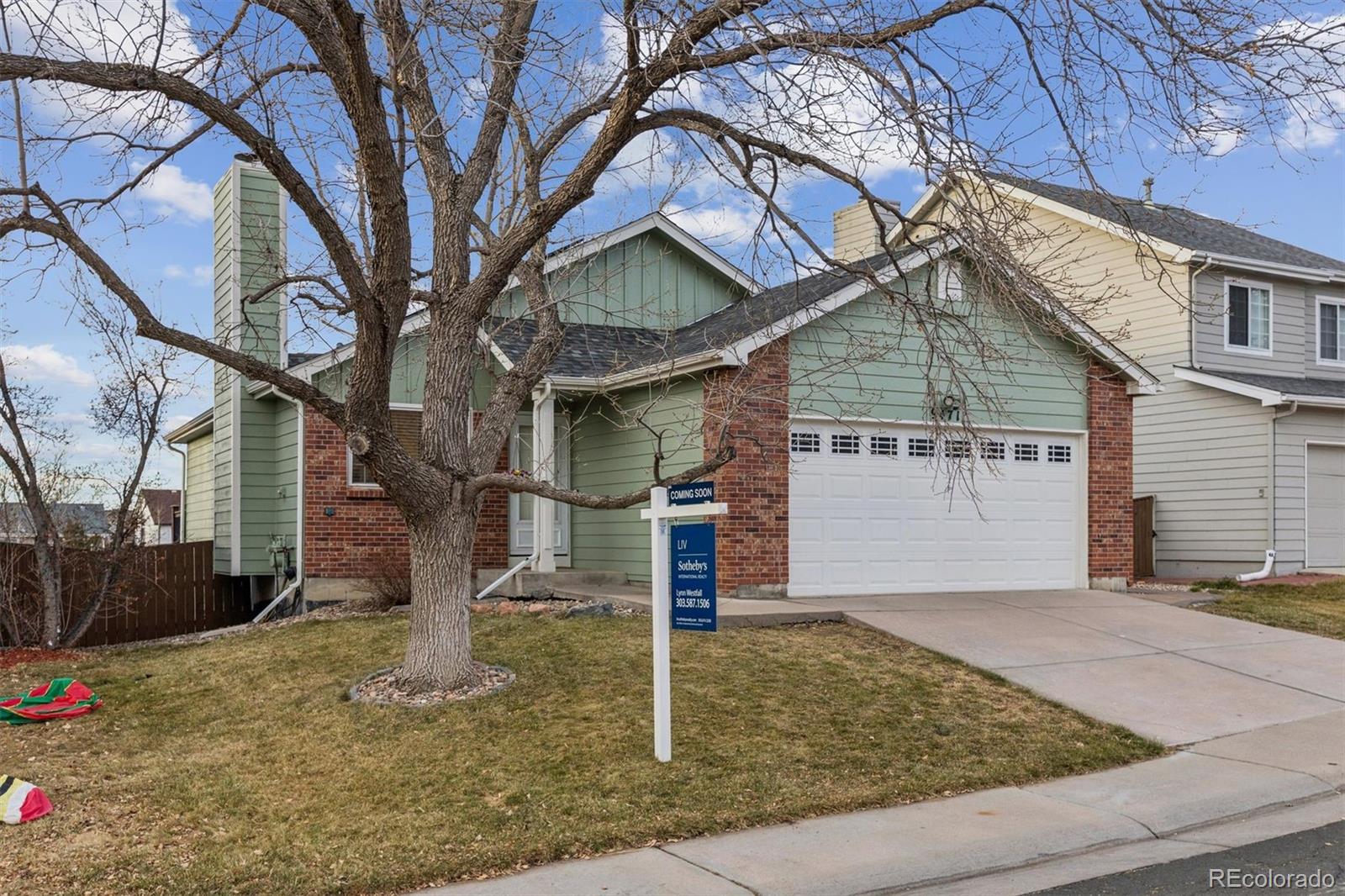 9471 Burlington Lane Highlands Ranch, CO 80130 - Photo 45 of 50 a front view of a house with garage