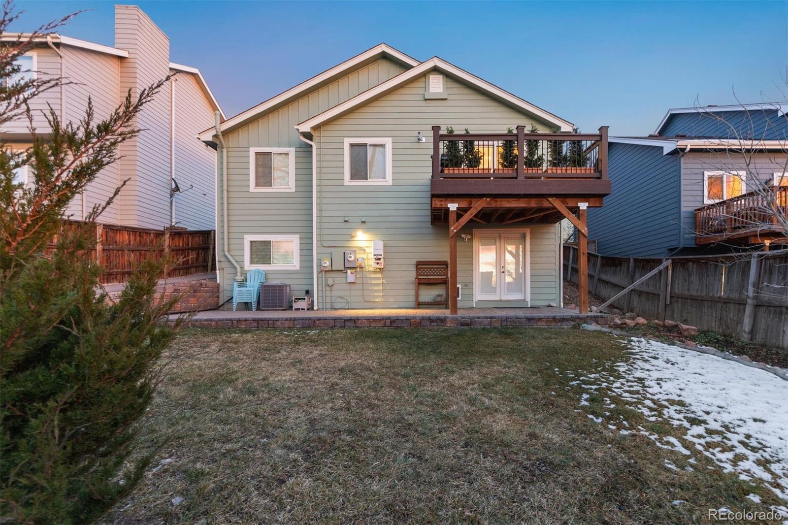 9471 Burlington Lane Highlands Ranch, CO 80130 - Photo 46 of 50 a view of a house with a yard