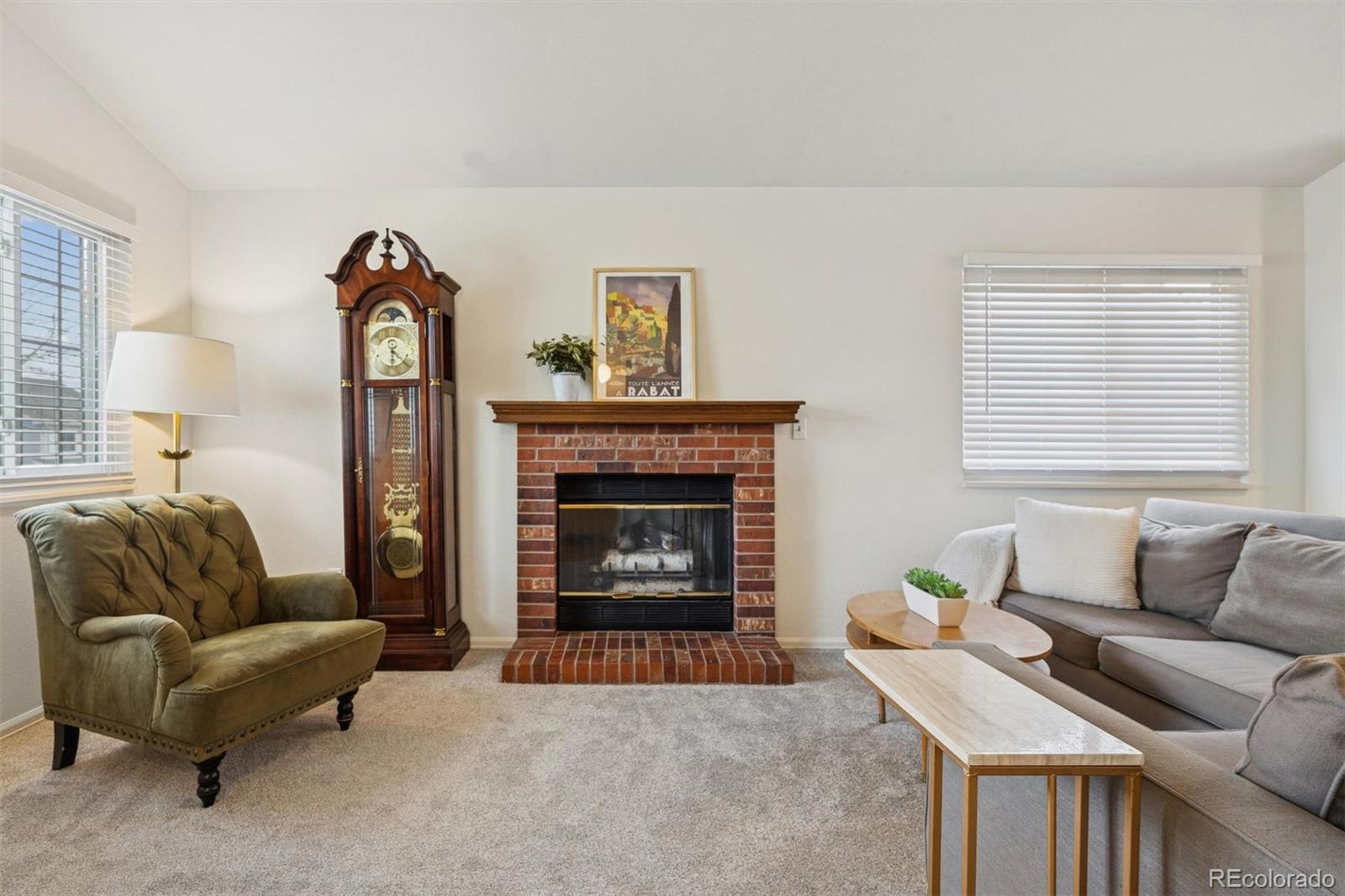 9471 Burlington Lane Highlands Ranch, CO 80130 - Photo 8 of 50 a living room with furniture and a fireplace