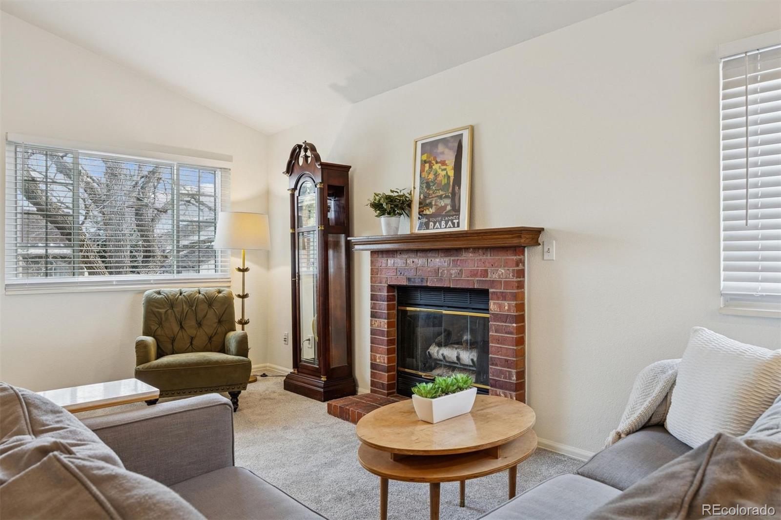 9471 Burlington Lane Highlands Ranch, CO 80130 - Photo 9 of 50 a living room with furniture and a fireplace