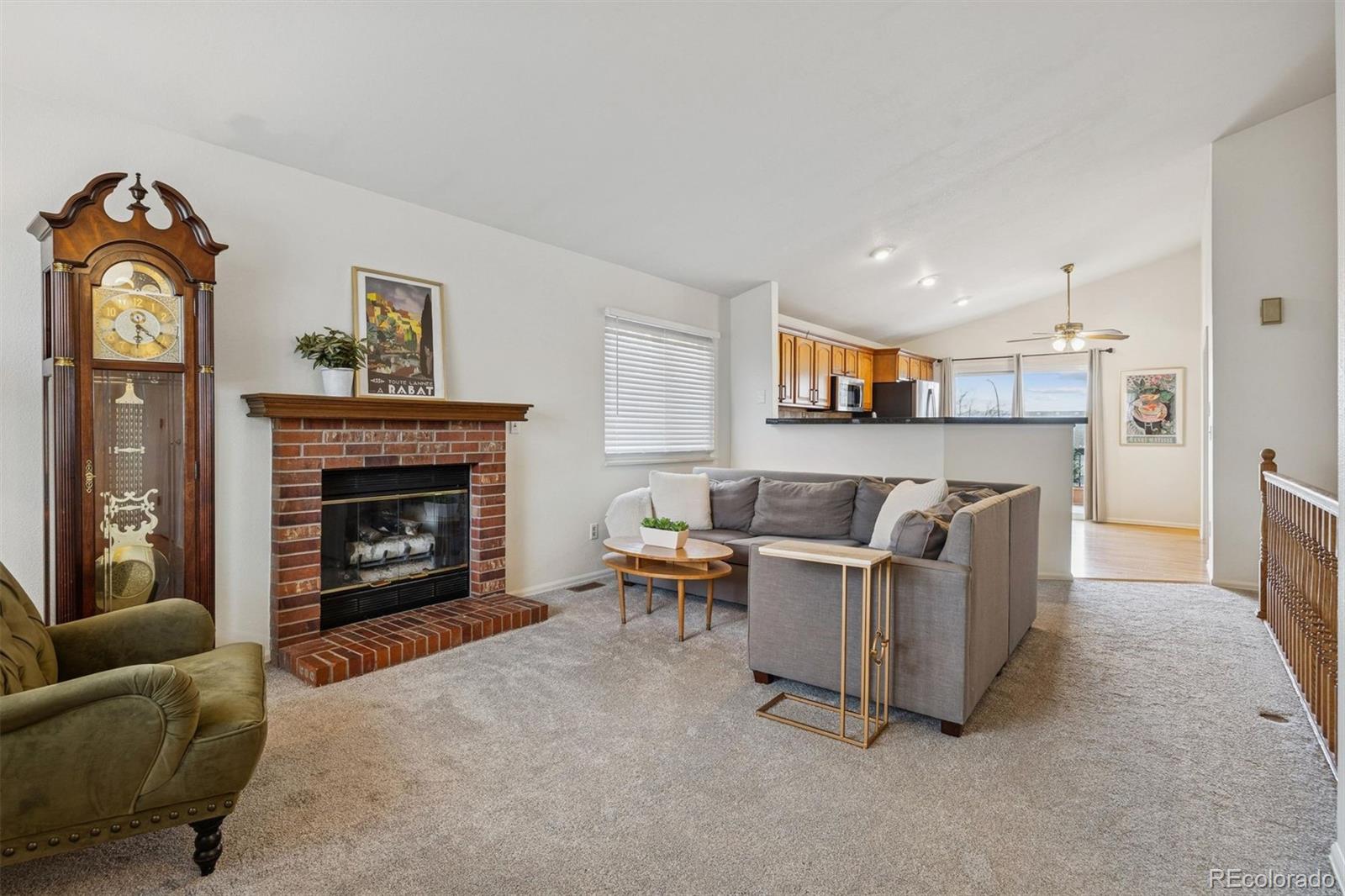9471 Burlington Lane Highlands Ranch, CO 80130 - Photo 10 of 50 a living room with furniture and a fireplace