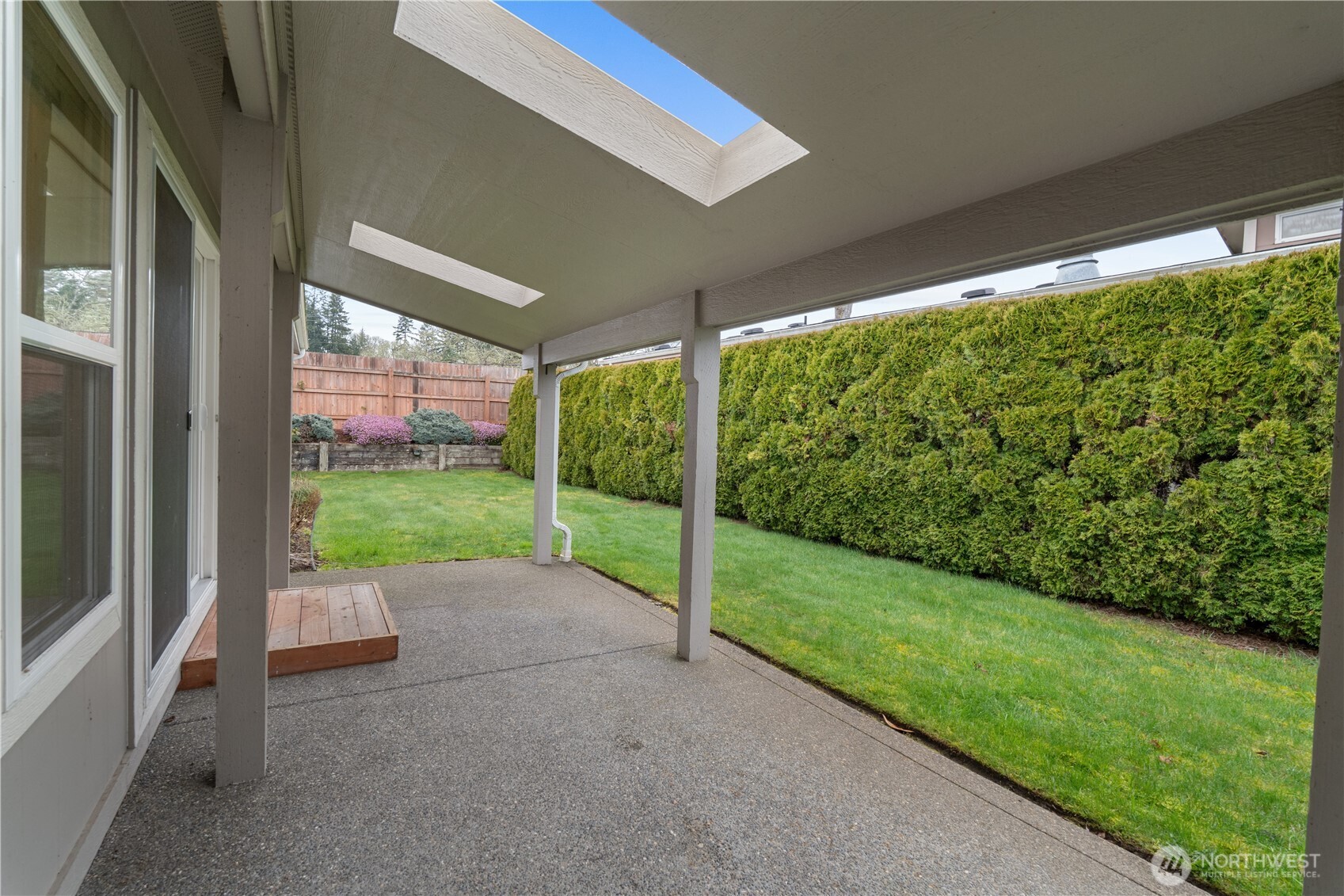 8014 18th Lane Southeast Lacey, WA 98503 - Photo 2 of 32 a view of a garden with an outdoor seating