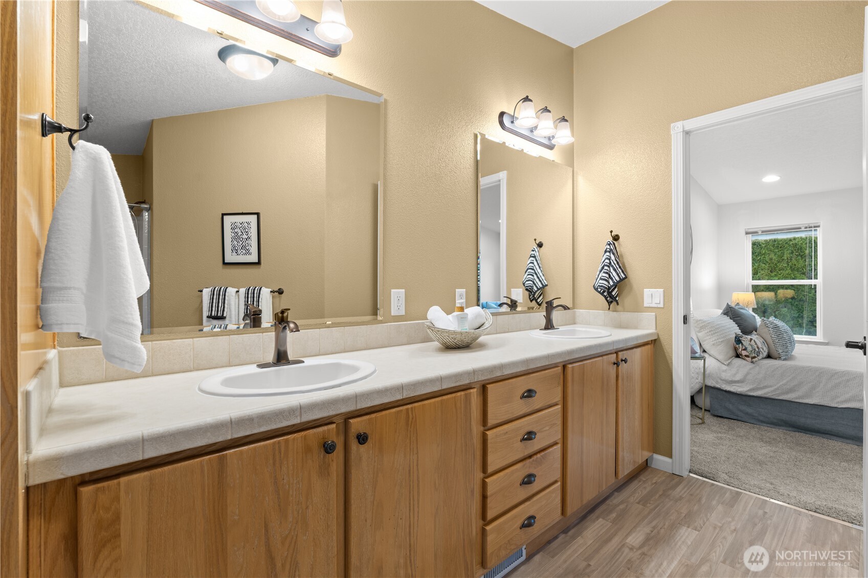 8014 18th Lane Southeast Lacey, WA 98503 - Photo 23 of 32 a bathroom with a double vanity sink and a mirror