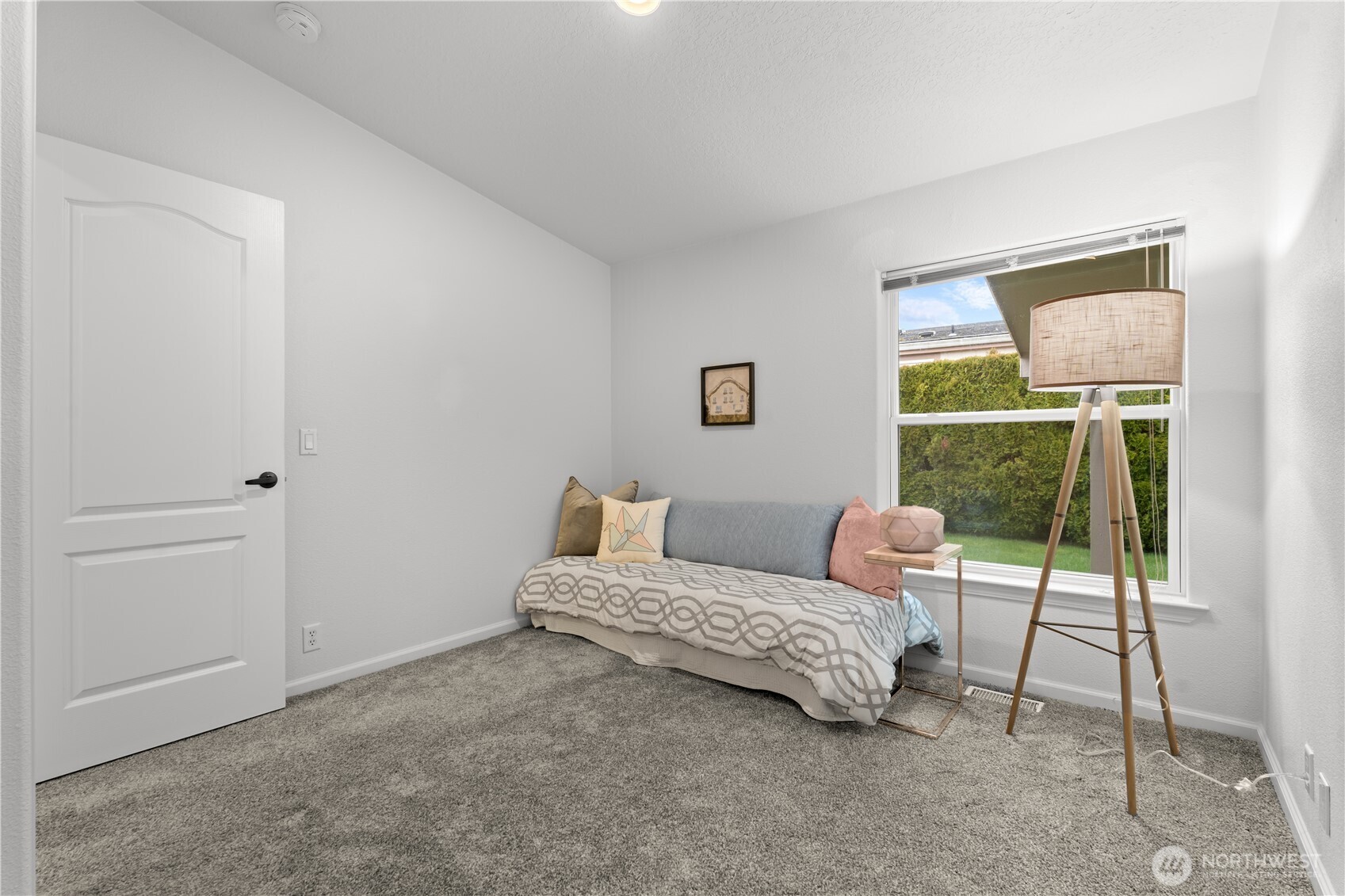 8014 18th Lane Southeast Lacey, WA 98503 - Photo 27 of 32 a bedroom with a bed and a window