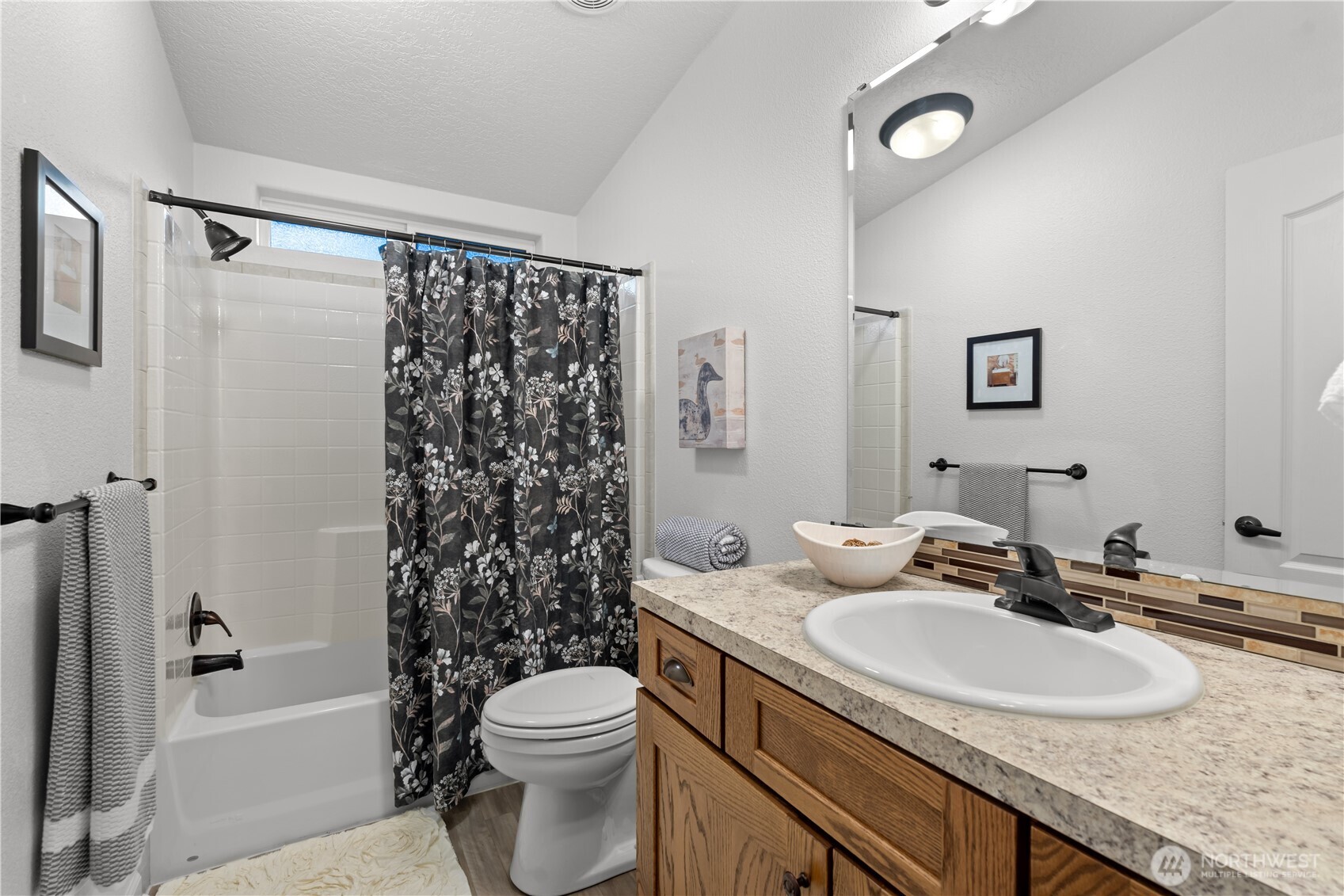 8014 18th Lane Southeast Lacey, WA 98503 - Photo 29 of 32 a bathroom with a granite countertop sink toilet and shower