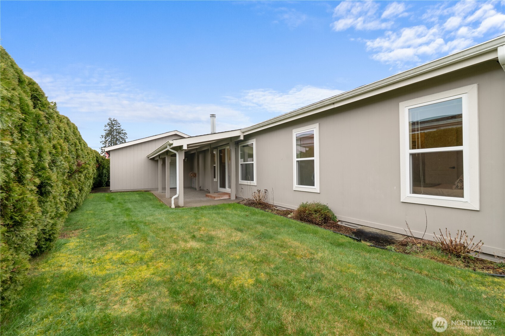 8014 18th Lane Southeast Lacey, WA 98503 - Photo 31 of 32 a backyard of a house with lots of green space