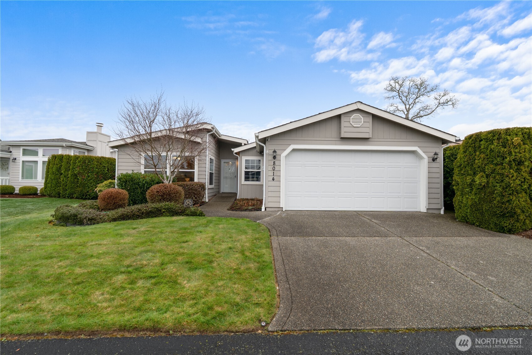 8014 18th Lane Southeast Lacey, WA 98503 - Photo 32 of 32 a front view of a house with garden