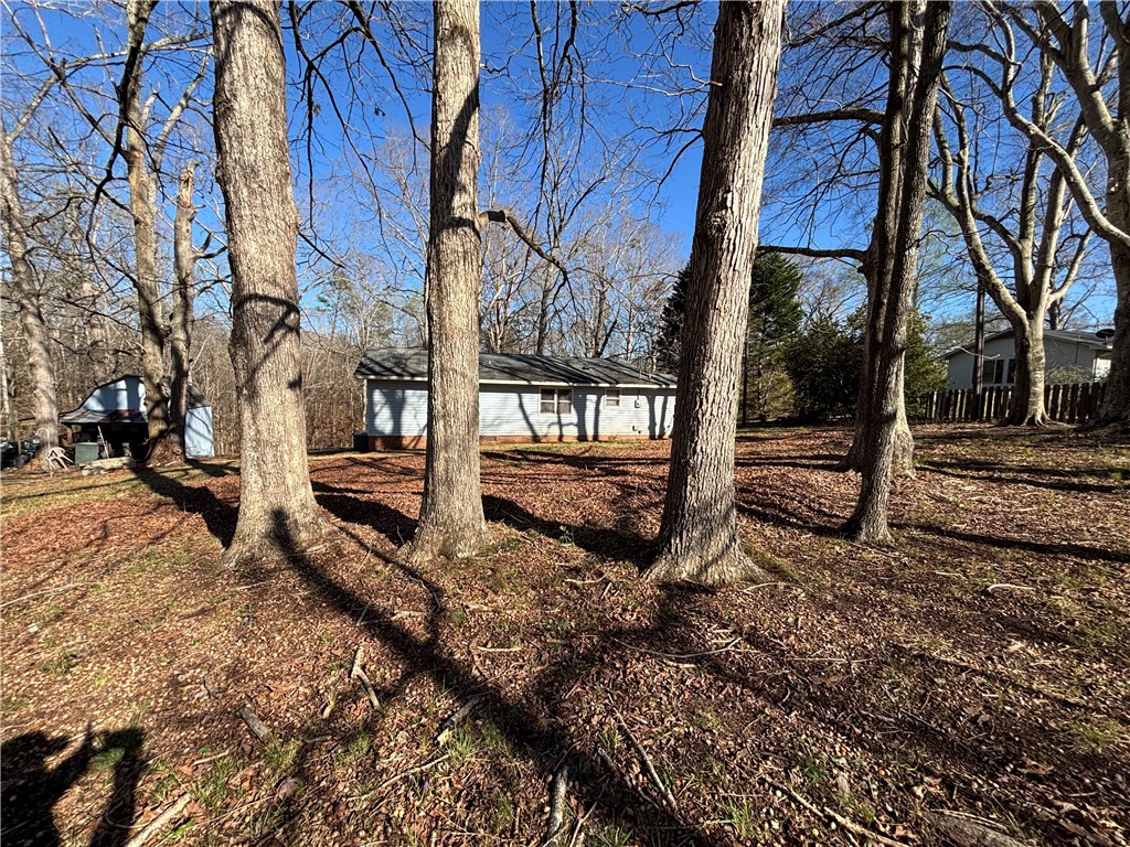 112 Ross Drive Starr, SC 29684 - Photo 21 of 23 A tranquil residential lot awaits, framed by mature trees, offering a private setting.