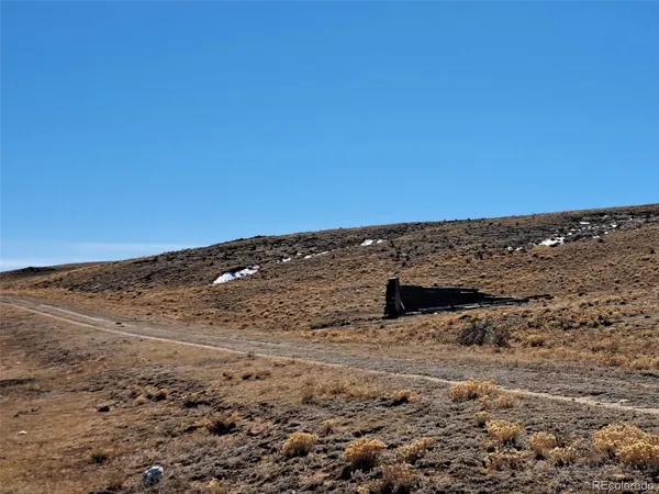a view of ocean beach and mountain