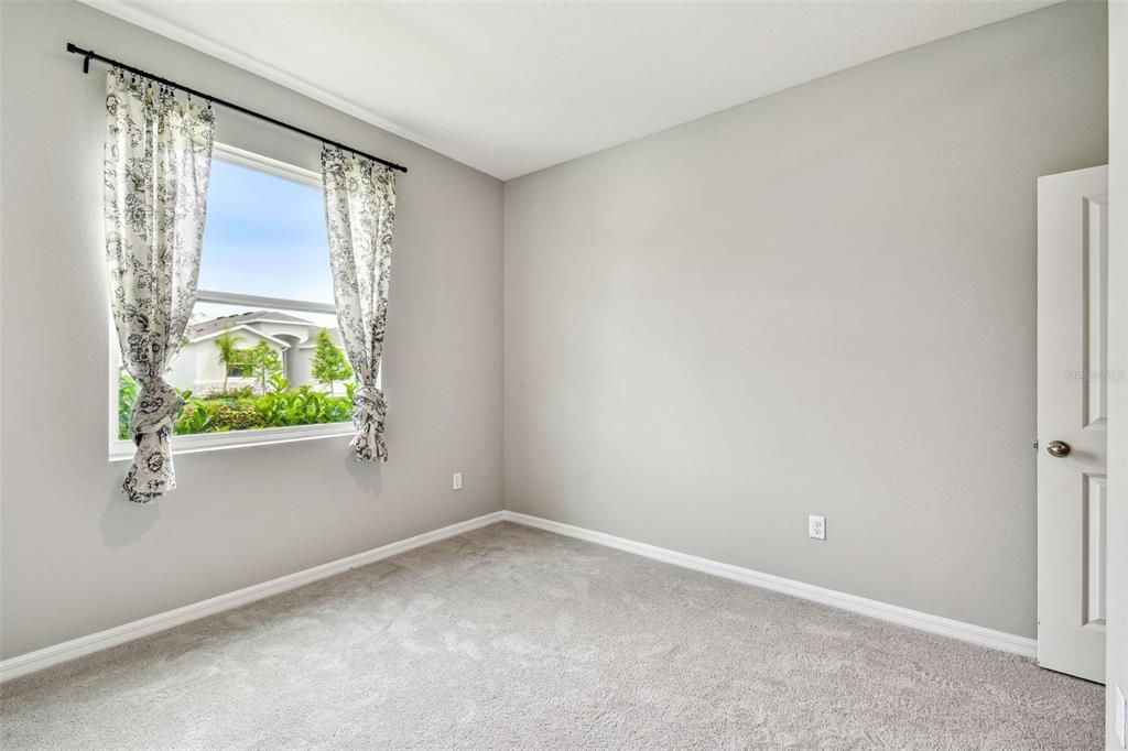 33870 Field Maple Loop Wesley Chapel, FL 33545 - Photo 11 of 38 an empty room with windows