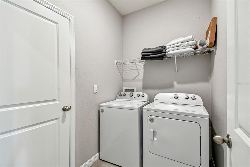 33870 Field Maple Loop Wesley Chapel, FL 33545 - Photo 17 of 38 a utility room with dryer and washer