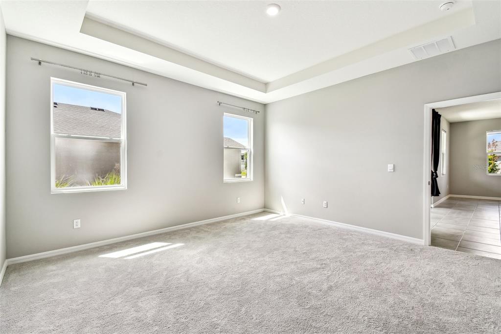 33870 Field Maple Loop Wesley Chapel, FL 33545 - Photo 6 of 38 an empty room with windows and closet