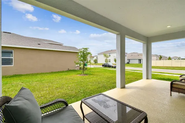 a room with pool table and a floor to ceiling window