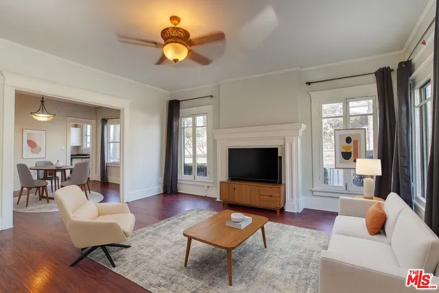 a living room with furniture a rug and a fireplace