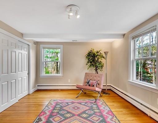 219 Sandy Pond Road Lincoln, MA 01773 - Photo 15 of 26 a house with swimming pool and wooden floor