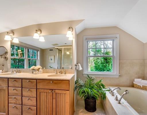 219 Sandy Pond Road Lincoln, MA 01773 - Photo 18 of 26 a bathroom with a granite countertop sink a large window and a potted plant