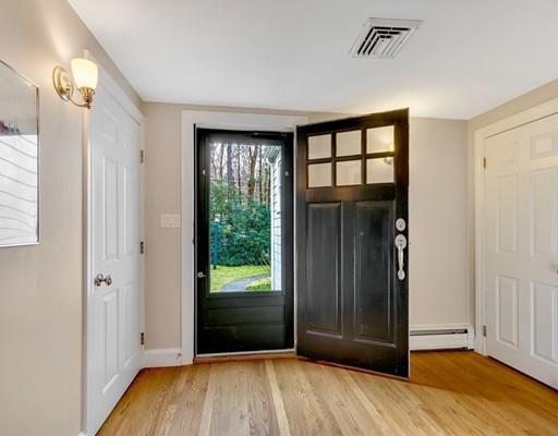 219 Sandy Pond Road Lincoln, MA 01773 - Photo 26 of 26 an empty room with wooden floor and windows