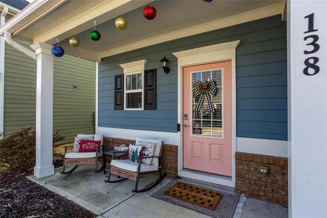 a backyard of a house with outdoor seating